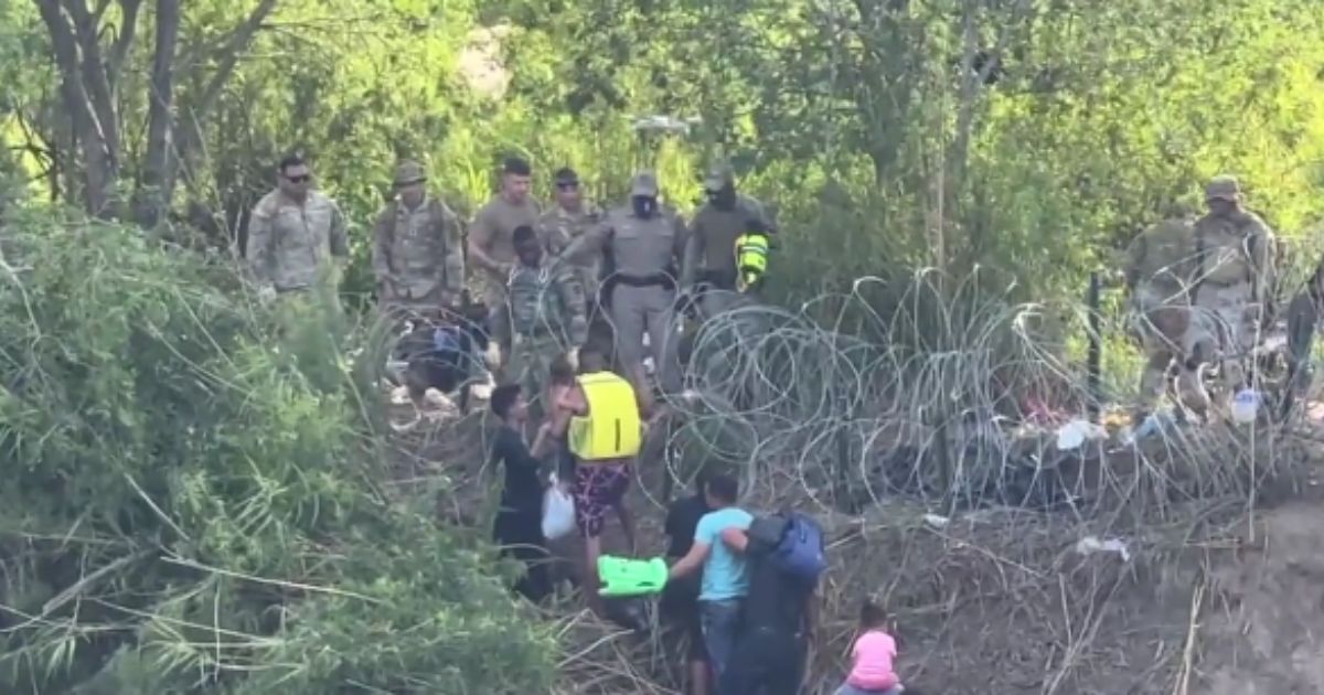Texas Department of Public Safety and the National Guard was filmed as they stopped migrants from entering.