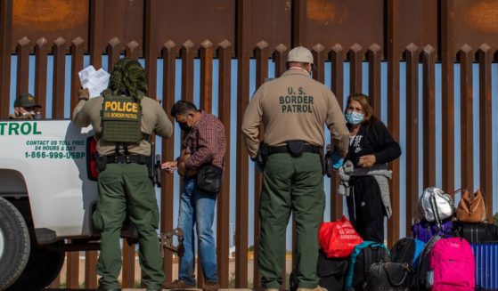 An asylum seeker from Colombia injects insulin after he turned himself in to US Border Patrol agents on May 13, 2021, in Yuma, Arizona.