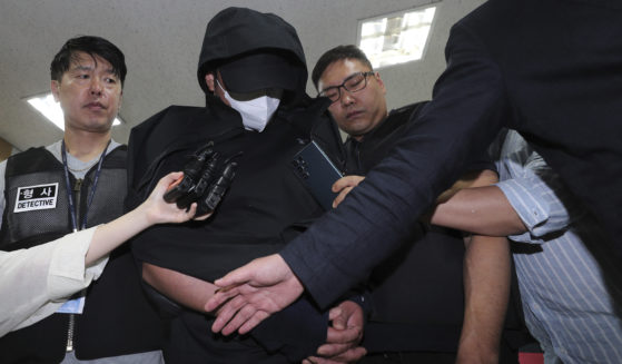 A man who opened an emergency exit door during a flight, arrives to attend an arrest warrant review at the Daegu District Court in Daegu, South Korea, on Sunday.