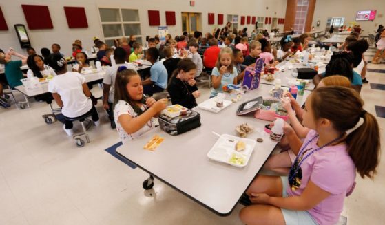 Students at Madison Crossing Elementary School in Canton, Miss., eat lunch in the school's cafeteria on Friday, Aug. 9, 2019. (Rogelio V. Solis / Associated Press)