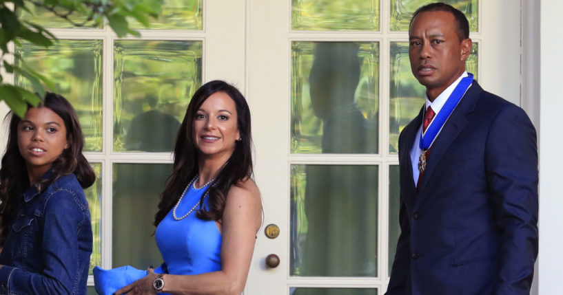 Tiger Woods, with his daughter, Sam Alexis Woods, left, and his then-girlfriend, Erica Herman, walks along the Colonnade following a ceremony where he was awarded the Presidential Medal of Freedom at the White House in Washington, on May 6, 2019.