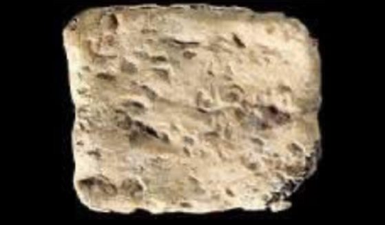 A tiny "curse tablet" found in an archaeological excavation in Israel.