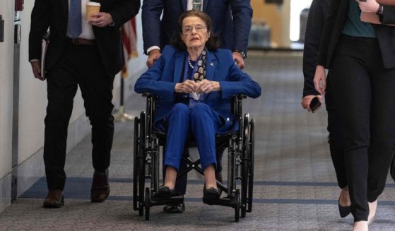Senator Dianne Feinstein (D-CA) is pushed in a wheelchair as she arrives for a Senate Judiciary Committee meeting on Capitol Hill in Washington, D.C., on Thursday.