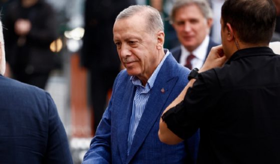 Turkish President Recep Tayyip Erdogan arrives at a school in Instanbul on Sunday to cast his vote in the Turkish presidential runoff election.
