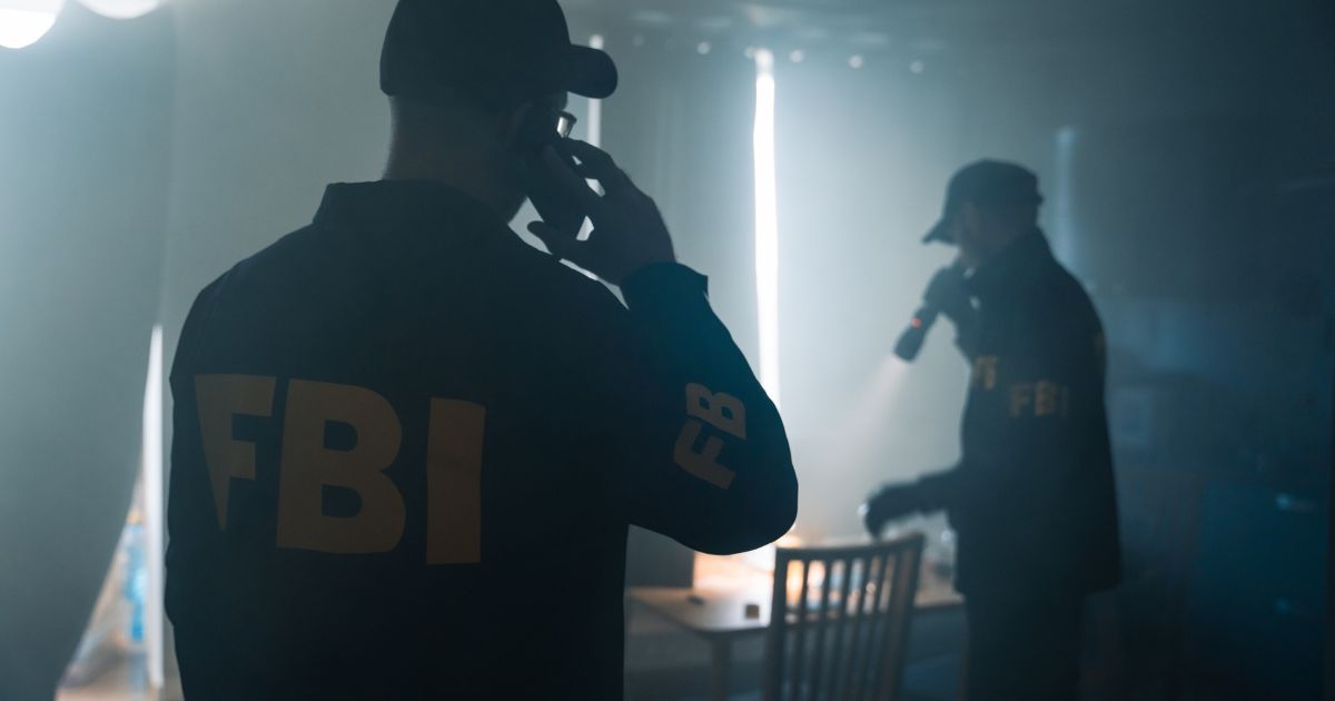 The above stock image shows two FBI agents.