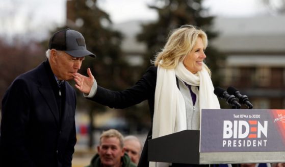 Joe Biden, then a contender for the Democratic presidential nomination, nibbles at the fingers of his wife, Jill, in a campaign photo in Iowa in 2019.