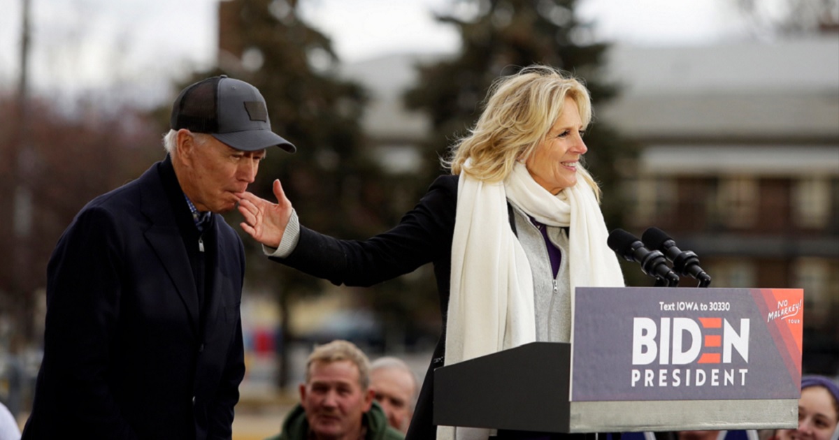 Joe Biden, then a contender for the Democratic presidential nomination, nibbles at the fingers of his wife, Jill, in a campaign photo in Iowa in 2019.