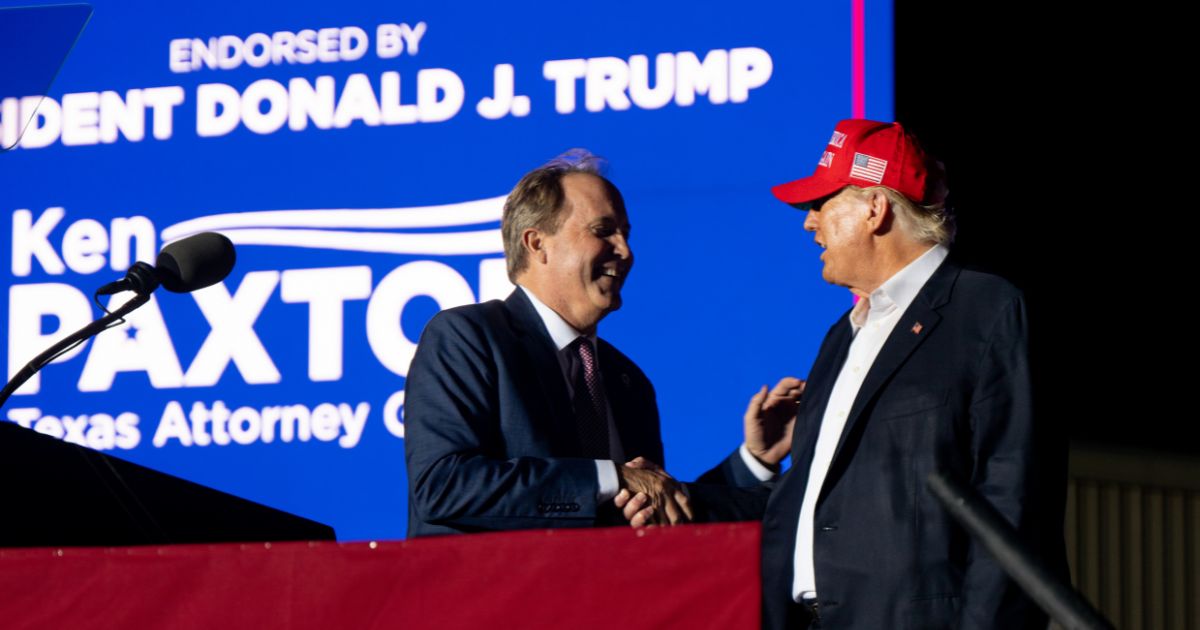 (L-R) Texas Attorney General Ken Paxton greets former U.S. President Donald Trump at the 'Save America' rally on October 22, 2022 in Robstown, Texas.