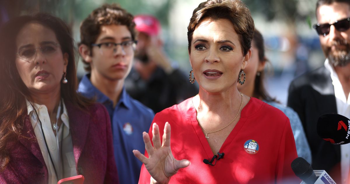 Arizona Republican gubernatorial candidate Kari Lake speaks to reporters after casting her ballot on Nov. 8, 2022, in Phoenix.