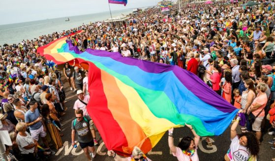 A giant rainbow pride flag is carried along the sea front during Brighton Pride 2019 on August 03, 2019 in Brighton, England.