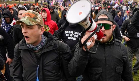 Proud Boys members Zachary Rehl, left, and Ethan Nordean, right, walk toward the U.S. Capitol in Washington, D.C., on Jan. 6, 2021.