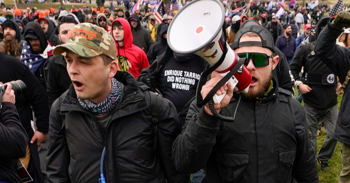 Proud Boys members Zachary Rehl, left, and Ethan Nordean, right, walk toward the U.S. Capitol in Washington, D.C., on Jan. 6, 2021.