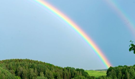 A rainbow is seen in the above stock image.