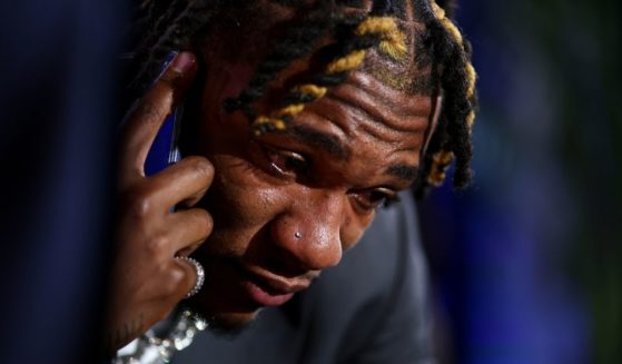 Anthony Richardson cries in the green room backstage while receiving news that he will be drafted by the Indianapolis Colts during the first round of the 2023 NFL Draft at Union Station on April 27 in Kansas City, Missouri.