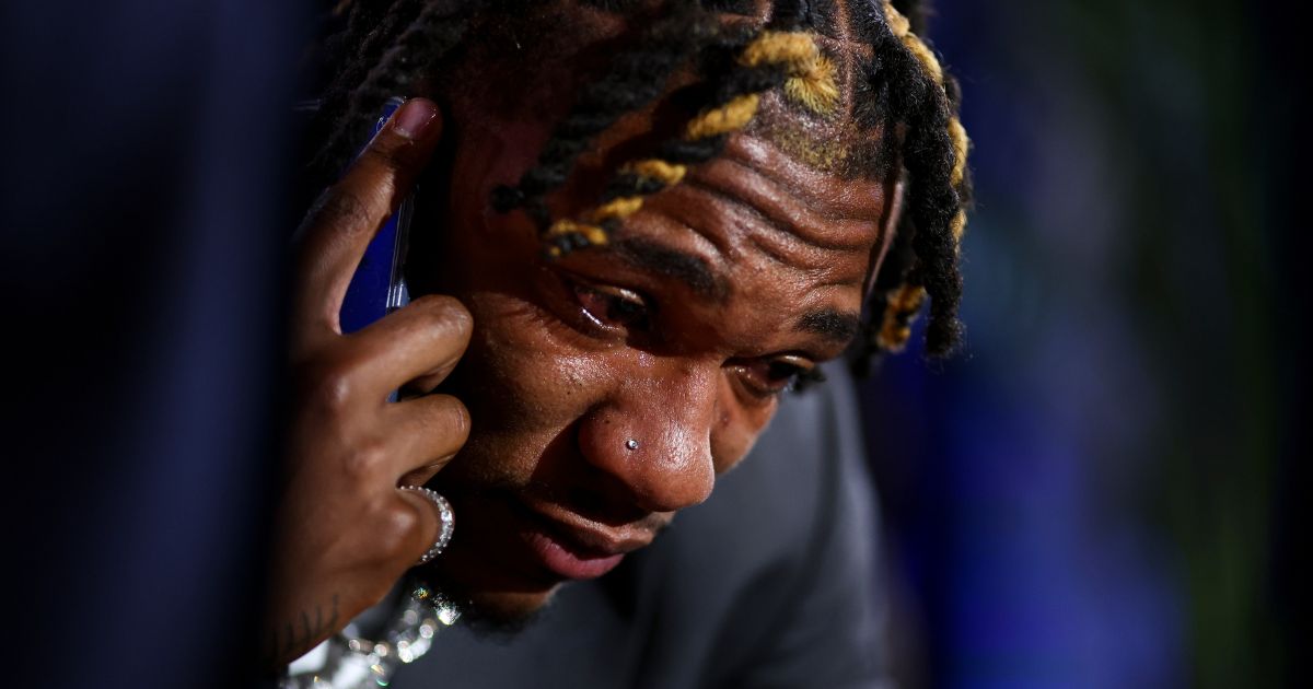 Anthony Richardson cries in the green room backstage while receiving news that he will be drafted by the Indianapolis Colts during the first round of the 2023 NFL Draft at Union Station on April 27 in Kansas City, Missouri.