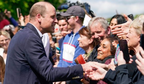 Britain's Prince William speaks to members of the public, during a walkabout on the Long Walk near Windsor Castle where the Coronation Concert to celebrate the coronation of King Charles III and Queen Camilla is being held, in Windsor, England, on Sunday.