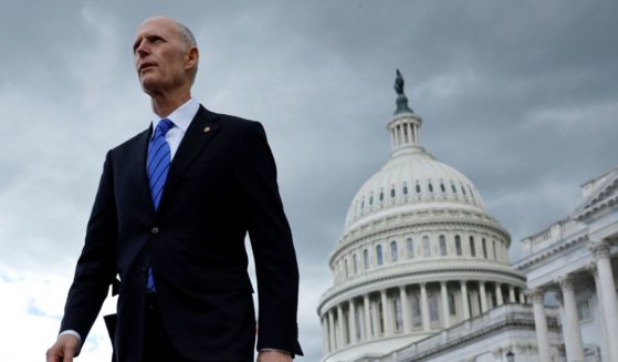 Sen. Rick Scott (R-FL) walks out of the U.S. Capitol for a news conference to urge the White House and Senate Democrats to pass the House GOP legislation that would raise the debt limit and cut federal spending on May 3 in Washington, D.C.