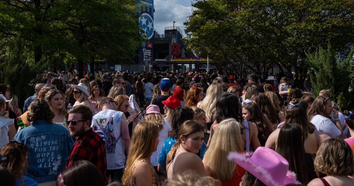 Fans wait in line outside of Nissan Stadium ahead of artist Taylor Swift's second night of performance on Saturday in Nashville, Tennessee.