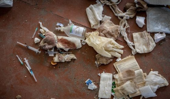 Used syringes, blood-stained gauze bandages, and surgical gloves are among remains of a Russian military field hospital that litter the Izium Middle School No. 2, which was used as a Russian military base during a six month occupation, in Izium, Ukraine, on September 25, 2022.
