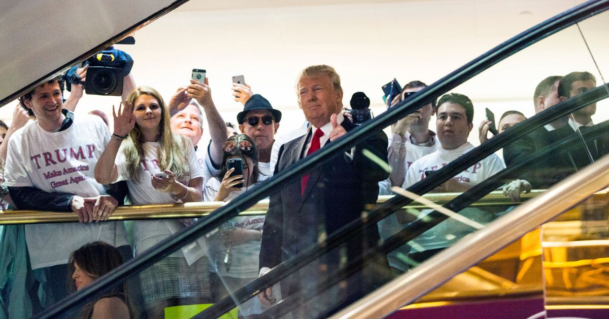 Then-business mogul Donald Trump rides an escalator to a press event to announce his candidacy for the U.S. presidency at Trump Tower on June 16, 2015, in New York City.