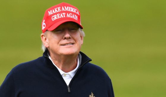 Former President Donald Trump reacts as he plays golf at the Trump Turnberry Golf Courses, in Turnberry on the west coast of Scotland on May 2.