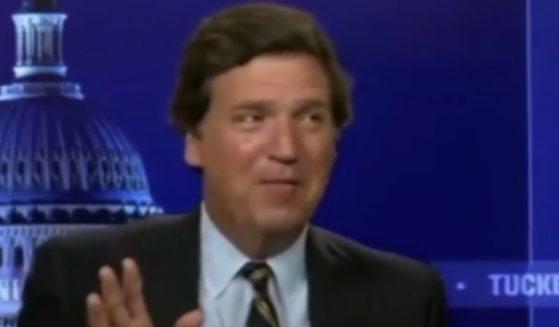 Tucker Carlson is seen in a behind-the-scenes video.