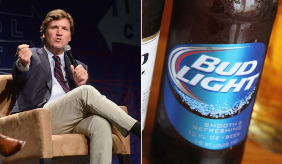 On the left, political commentator Tucker Carlson speaks during Politicon 2018 at Los Angeles Convention Center on Oct. 21, 2018, in Los Angeles, and to the right is a bottle of Bud Light.