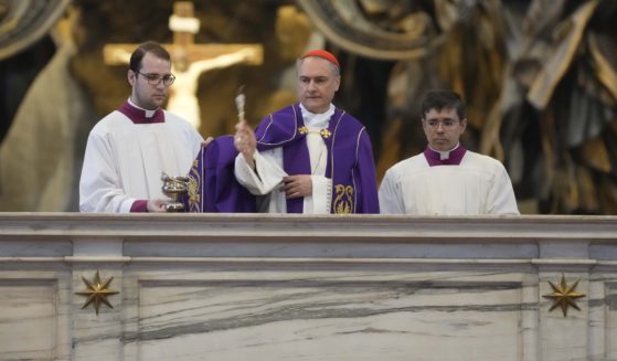 Cardinal Mauro Bassetti, center, blesses the altar of the confession during a penitential rite inside St. Peter's Basilica Saturday.