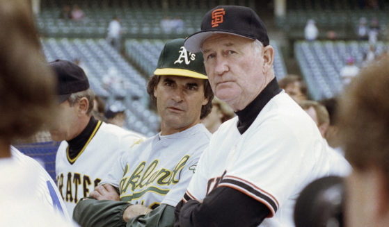 National League manager Roger Craig of the San Francisco Giants, right, and American League manager Tony La Russa of the Oakland A's watch batting practice before the 61st MLB All-Star Game at Wrigley Field in Chicago on July 10, 1990.