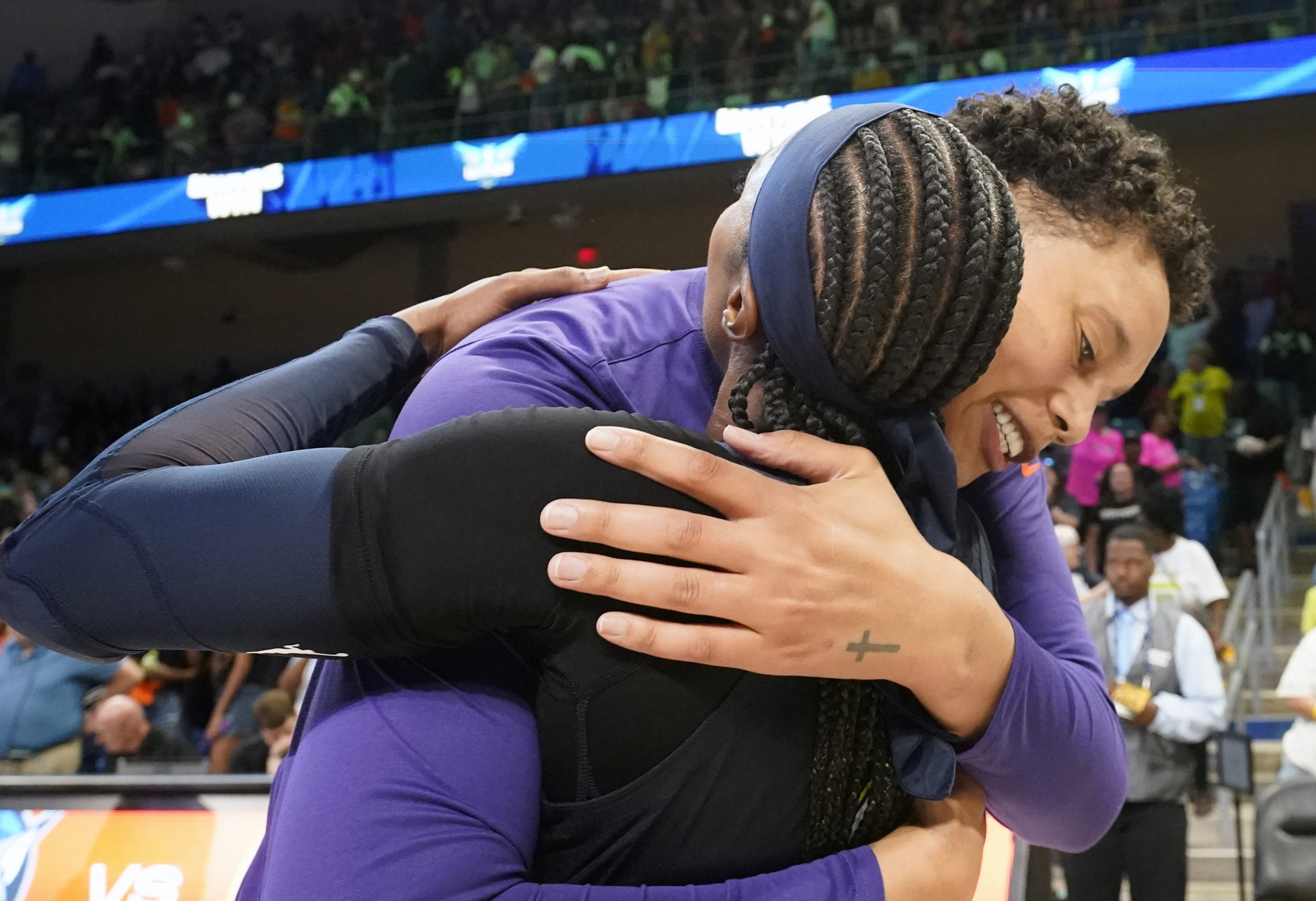 Brittney Griner, right, hugs former college teammate Odyssey Sims, left, after a WNBA basketball basketball game in Arlington, Texas, on Friday.