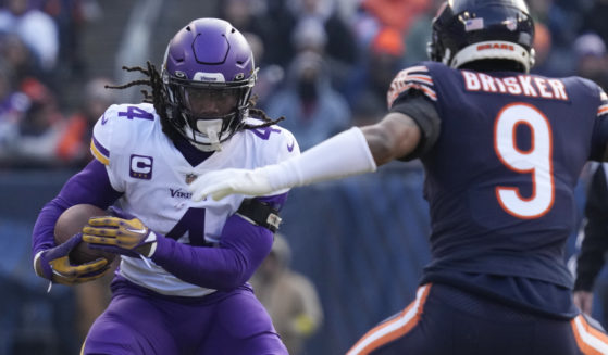 Minnesota Vikings running back Dalvin Cook runs against the Chicago Bears during the first half of an NFL football game on Jan. 8, 2023, in Chicago. The Minnesota Vikings are parting ways with the star running back for salary cap savings after his fourth consecutive season surpassing the 1,000-yard rushing mark. Cook has been informed he will be released, a person familiar with the team’s decision told The Associated Press on Thursday, June 8.