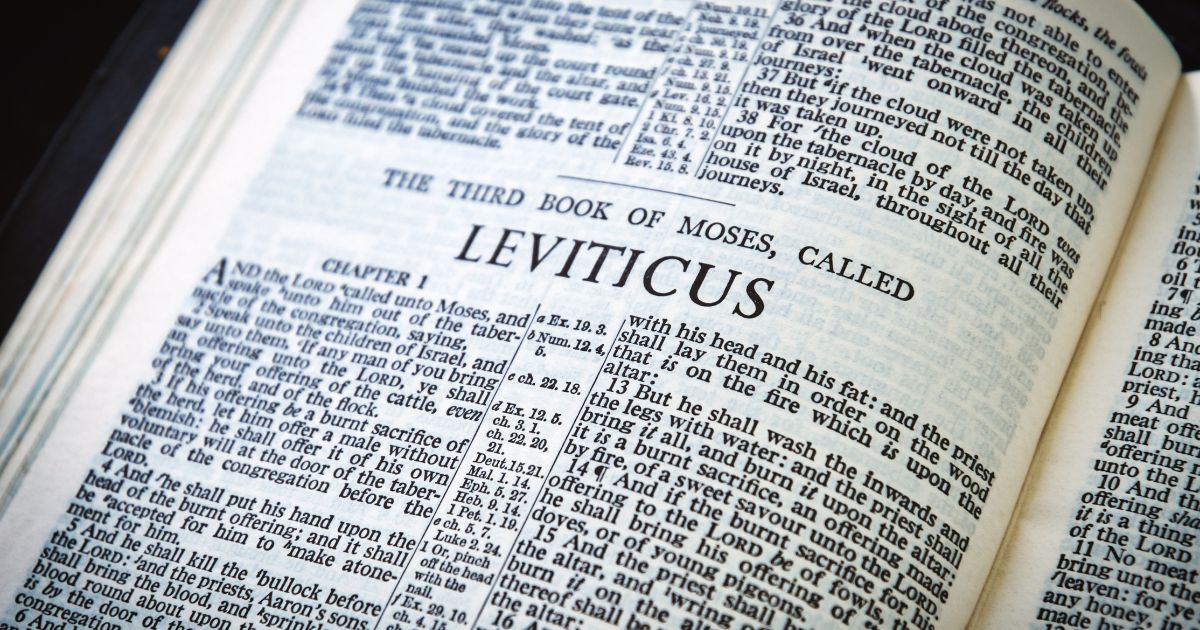 A Bible lies open to the book of Leviticus in the above stock image.