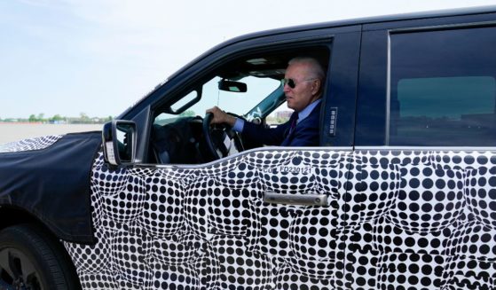 President Joe Biden sits behind the wheel of a Ford F-150 Lightning truck at the Ford Dearborn Development Center in Dearborn, Michigan, on May 18, 2021.