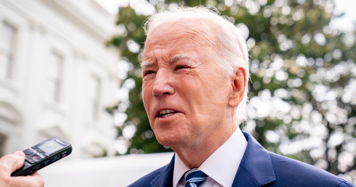 Marks are seen on President Joe Biden's face as he speaks with members of the media before boarding Marine One on the South Lawn of the White House in Washington on Wednesday.