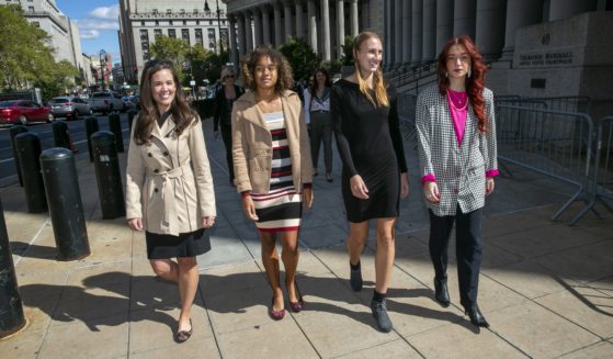 Attorney Christiana Kiefer and plaintiffs Alanna Smith, Chelsea Mitchell and Selina Soule walk outside federal court in lower Manhattan in New York City on Sept. 29, 2022.