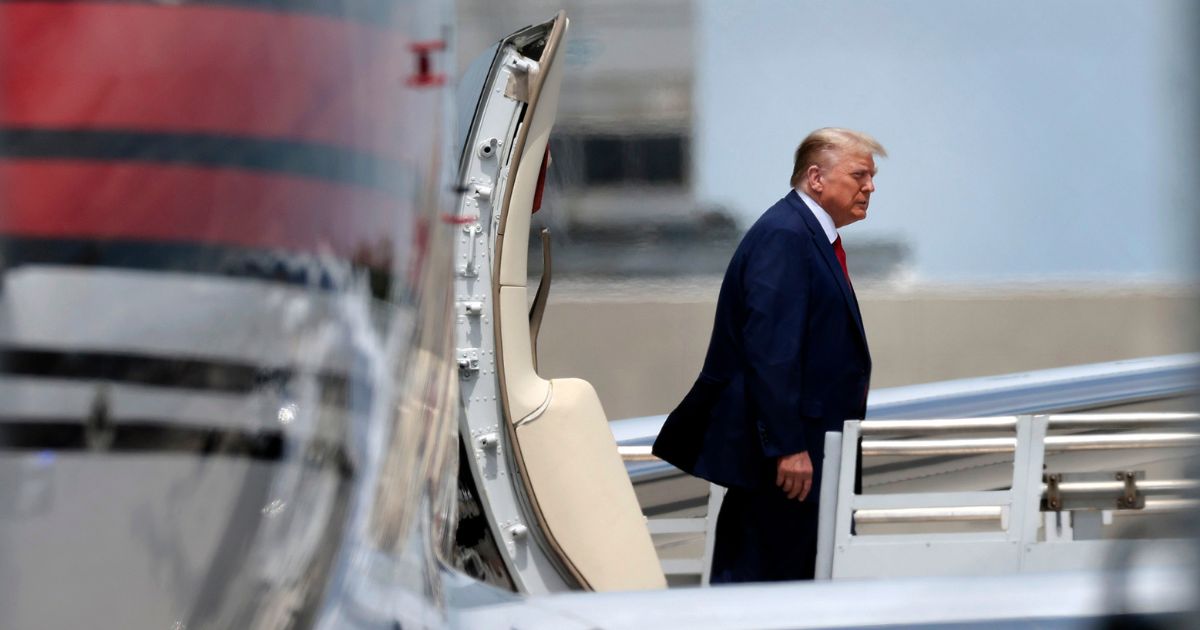 Former President Donald Trump arrives at Miami International Airport on Monday in Miami.