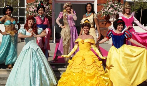 Disney princesses pose together as they officially welcomed Rapunzel into their ranks during an event at Kensington Palace in London on Oct. 2, 2011.