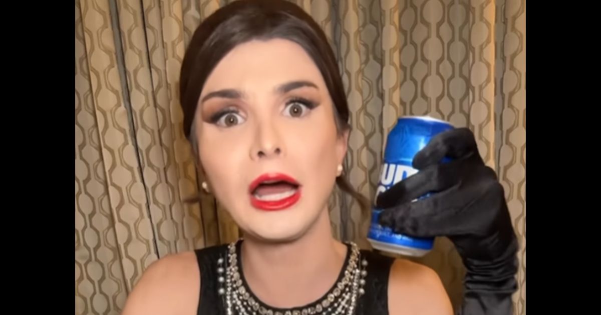 Transgender activist Dylan Mulvaney holds a can of Bud Light during a promotional video.