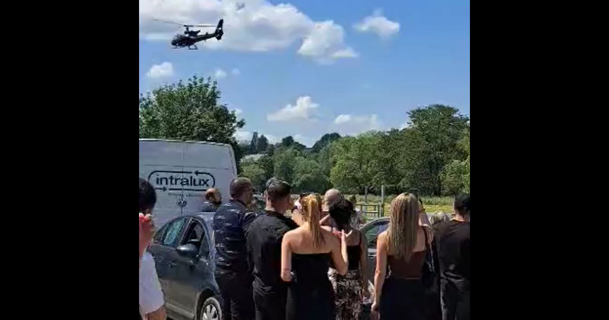 Man fakes death, arrives at funeral by helicopter.