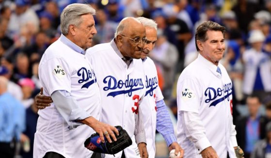 Steve Garvey, right, walks with fellow former Los Angeles Dodgers, from left, Rick Monday, Don Newcombe and Sandy Koufax after the ceremonial first pitch prior to Game 7 of the World Series between the Houston Astros and the Dodgers at Dodger Stadium on Nov. 1, 2017.
