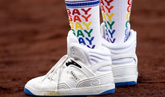 A baseball fan's "gay" socks are seen before a game between the New York Mets and the Los Angeles Dodgers on LGBTQ+ Pride Night at Dodger Stadium in June 2022. LGBT activists are questioning why the Texas Rangers are not hosting a "pride night."