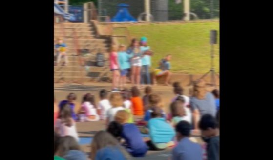 Fourth-graders at Johnson Elementary School in Charlottesville, Virginia, read from "ABC Pride" during a school assembly June 2.