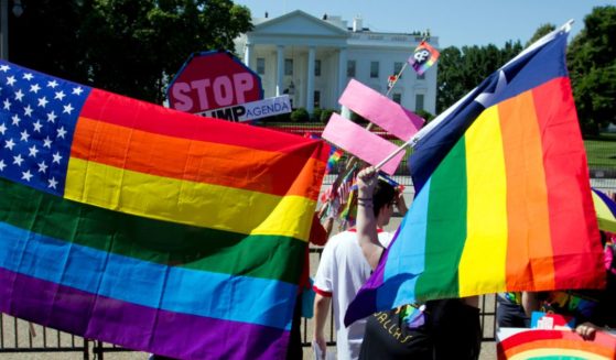 LGBT members and their supporters take part in the Equality March for Unity & Pride parade outside the White House in a file photo from June 2017.