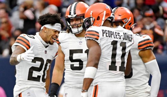 Greg Newsome II, left, celebrates with Donovan Peoples-Jones, right, and other Cleveland Browns teammates after Peoples-Jones' punt return for a touchdown against the Houston Texans at NRG Stadium on Dec. 4, 2022.