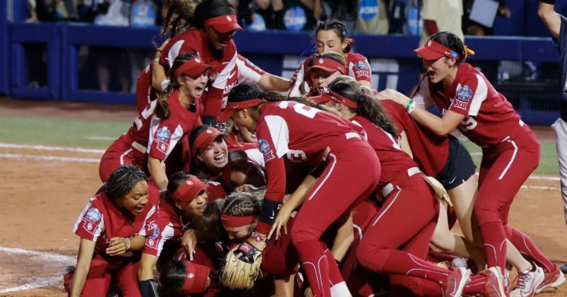 Oklahoma players celebrate after defeating Florida State in the NCAA Women's College World Series softball championship series on Thursday in Oklahoma City. (Nate Billings / AP)