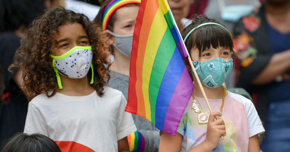 A little girl holds a "pride" flag during a performance at "Brooklyn Pride" in New York City on May 19, 2021.