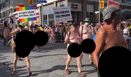 Naked men walk in Toronto's "pride" parade Sunday.