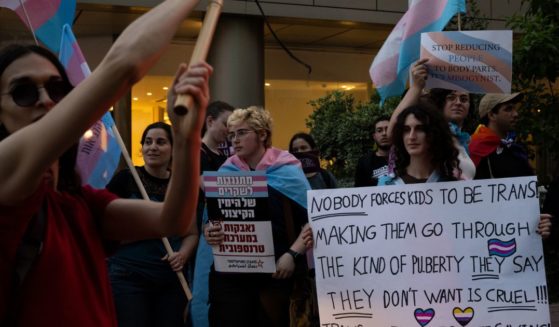 People protest outside a lecture by author Abigail Shrier about ‘protecting children from Trans fashion’ on May 28 in Ramat Gan, Israel.