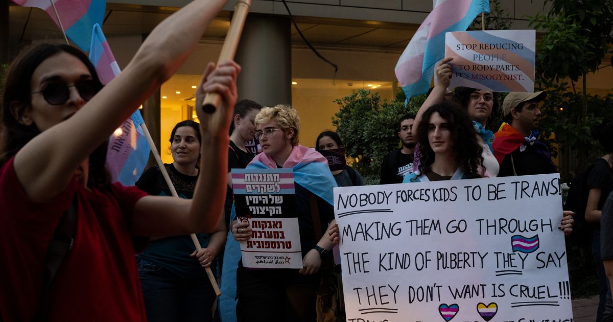People protest outside a lecture by author Abigail Shrier about ‘protecting children from Trans fashion’ on May 28 in Ramat Gan, Israel.