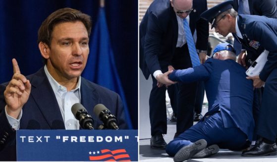 Florida Gov. Ron DeSantis speaks during a campaign stop at Manchester Community College in Manchester, New Hampshire, on Thursday. President Joe Biden is helped up after falling during the graduation ceremony at the U.S. Air Force Academy in El Paso County, Colorado, on Thursday.